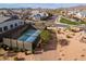 Aerial view of a pickleball court in a community near residential homes and a desert landscape at 8043 E Jaeger St, Mesa, AZ 85207