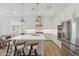 Well-lit kitchen featuring a center island, stainless steel appliances, and pendant lighting at 8043 E Jaeger St, Mesa, AZ 85207