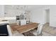 Open concept kitchen featuring an island with bar stools, stainless steel appliances, and a casual eating area at 8043 E Jaeger St, Mesa, AZ 85207