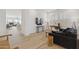Stylish living room with wood-look tile floors, modern lighting, and sleek furniture at 8043 E Jaeger St, Mesa, AZ 85207