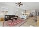 Spacious living room featuring hardwood floors, natural light, with open access to the kitchen at 8043 E Jaeger St, Mesa, AZ 85207