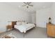 Bright main bedroom featuring neutral decor, a ceiling fan, and an ensuite bathroom at 8043 E Jaeger St, Mesa, AZ 85207