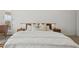Modern bedroom featuring a comfortable bed with lamps, carpet, and neutral paint at 8043 E Jaeger St, Mesa, AZ 85207