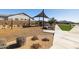 Community playground featuring a climbing structure, shade canopy, and walking path at 8043 E Jaeger St, Mesa, AZ 85207