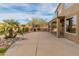 Lush backyard with a pool, patio, and mature landscaping, creating an ideal outdoor oasis at 8340 E Rowel Rd, Scottsdale, AZ 85255