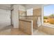 Tiled bathroom featuring a glass-enclosed shower with dual showerheads and a window offering natural light and desert views at 8340 E Rowel Rd, Scottsdale, AZ 85255