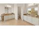 Spacious bathroom with tiled floor and dual sinks at 8340 E Rowel Rd, Scottsdale, AZ 85255