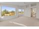 Large bedroom with carpet, views from many windows, and a ceiling fan at 8340 E Rowel Rd, Scottsdale, AZ 85255