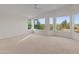 Bright bedroom with carpet, many windows, and a ceiling fan at 8340 E Rowel Rd, Scottsdale, AZ 85255