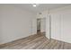 Bedroom featuring wood-look flooring, closet storage, and neutral walls at 8340 E Rowel Rd, Scottsdale, AZ 85255