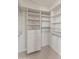 Walk-in closet with shelving, drawers, and carpet at 8340 E Rowel Rd, Scottsdale, AZ 85255