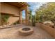 Outdoor patio features a cozy fire pit with brick pavers at 8340 E Rowel Rd, Scottsdale, AZ 85255