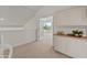 Upstairs hallway features carpet and cabinetry with a peek to the bedroom at 8340 E Rowel Rd, Scottsdale, AZ 85255