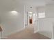 Upstairs hallway with neutral carpeting, leading to the bathrooms and bedrooms at 8340 E Rowel Rd, Scottsdale, AZ 85255