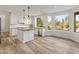 Bright kitchen with stainless steel appliances, large windows, and desert views at 8340 E Rowel Rd, Scottsdale, AZ 85255