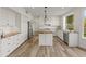 Bright kitchen featuring white cabinetry, a subway tile backsplash and granite countertops at 8340 E Rowel Rd, Scottsdale, AZ 85255