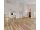 Open-concept living room with hardwood floors and high ceilings, perfect for entertaining at 8340 E Rowel Rd, Scottsdale, AZ 85255