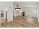 Well-lit living room featuring hardwood floors and high ceilings at 8340 E Rowel Rd, Scottsdale, AZ 85255