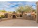 Outdoor space with built-in BBQ and pizza oven, perfect for entertaining guests and enjoying outdoor dining at 8340 E Rowel Rd, Scottsdale, AZ 85255