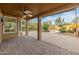 Covered patio featuring a built-in BBQ and pizza oven, surrounded by lush landscaping and serene views at 8340 E Rowel Rd, Scottsdale, AZ 85255