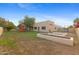 Expansive backyard featuring a play structure, garden beds, and a well-manicured lawn at 8821 N 9Th Ave, Phoenix, AZ 85021