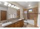 Double vanity bathroom with a shower and a large mirror with attractive lighting at 8821 N 9Th Ave, Phoenix, AZ 85021