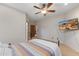 Bedroom featuring a flat screen TV, ceiling fan, and neutral color palette at 8821 N 9Th Ave, Phoenix, AZ 85021