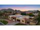 Spacious desert home featuring a two-car garage, basketball hoop, and mountain views in a gated neighborhood at 8821 N 9Th Ave, Phoenix, AZ 85021