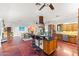 Open-concept kitchen with a breakfast bar, granite countertops, and stainless steel appliances, flowing into the dining area at 8821 N 9Th Ave, Phoenix, AZ 85021