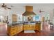 Spacious kitchen featuring custom wood cabinetry, an expansive island, and a professional-grade range at 8821 N 9Th Ave, Phoenix, AZ 85021