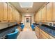 Functional office space with built-in cabinets, granite countertops, and dedicated work areas for productivity at 8821 N 9Th Ave, Phoenix, AZ 85021