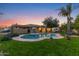 Backyard oasis with pool, mature trees, and a play structure at 8821 N 9Th Ave, Phoenix, AZ 85021