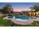Backyard at dusk showcasing the pool, patio area, and well-maintained landscaping at 8821 N 9Th Ave, Phoenix, AZ 85021