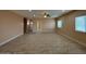 Expansive living room with tile floors, recessed lights, and a ceiling fan at 9408 W Jackson St, Tolleson, AZ 85353