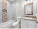 This bathroom features a shower and tub combination, granite counters, and decorative backsplash at 9460 W Hartigan Ln, Arizona City, AZ 85123