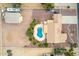 Overhead view of a single-Gathering home featuring a swimming pool, desert landscaping, and a detached garage at 9768 W Prospector Dr, Queen Creek, AZ 85144