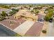 Aerial view of a single-story home with desert landscaping, spacious yard, and a three-car garage at 9768 W Prospector Dr, Queen Creek, AZ 85144