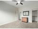 Cozy bedroom with carpeted floors, a ceiling fan, and a closet at 9768 W Prospector Dr, Queen Creek, AZ 85144