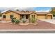 Charming home featuring desert landscaping with cactus and rock accents in the front yard at 9768 W Prospector Dr, Queen Creek, AZ 85144