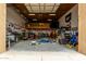 Spacious garage with high ceilings, ample storage, and workspace at 9768 W Prospector Dr, Queen Creek, AZ 85144