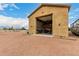 Spacious garage with high ceilings, ample storage, and workspace at 9768 W Prospector Dr, Queen Creek, AZ 85144