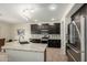 Stylish kitchen showcasing granite countertops, stainless steel appliances, and dark wood cabinets at 9768 W Prospector Dr, Queen Creek, AZ 85144