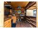 Outdoor bar with wood accents, overhead lighting, and plenty of space at 9768 W Prospector Dr, Queen Creek, AZ 85144