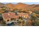 Aerial view of desert homes, showcasing community layout and outdoor living spaces with pool at 11617 E Raintree Dr, Scottsdale, AZ 85255