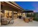 Cozy back patio with lounge seating, a barbecue grill, and views of the surrounding desert landscape at 11617 E Raintree Dr, Scottsdale, AZ 85255