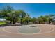 Outdoor basketball court surrounded by native desert trees and foliage at 11617 E Raintree Dr, Scottsdale, AZ 85255