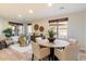 Bright dining room with elegant decor, featuring hardwood floors and natural light creating a cozy atmosphere at 11617 E Raintree Dr, Scottsdale, AZ 85255