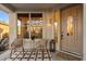 Welcoming front porch with stylish seating and decor creating a charming entrance at 11617 E Raintree Dr, Scottsdale, AZ 85255