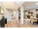 Bright hallway with hardwood floors connects the living spaces in an open floor plan at 11617 E Raintree Dr, Scottsdale, AZ 85255