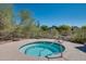 Secluded hot tub features desert landscaping and beautiful weather at 11617 E Raintree Dr, Scottsdale, AZ 85255